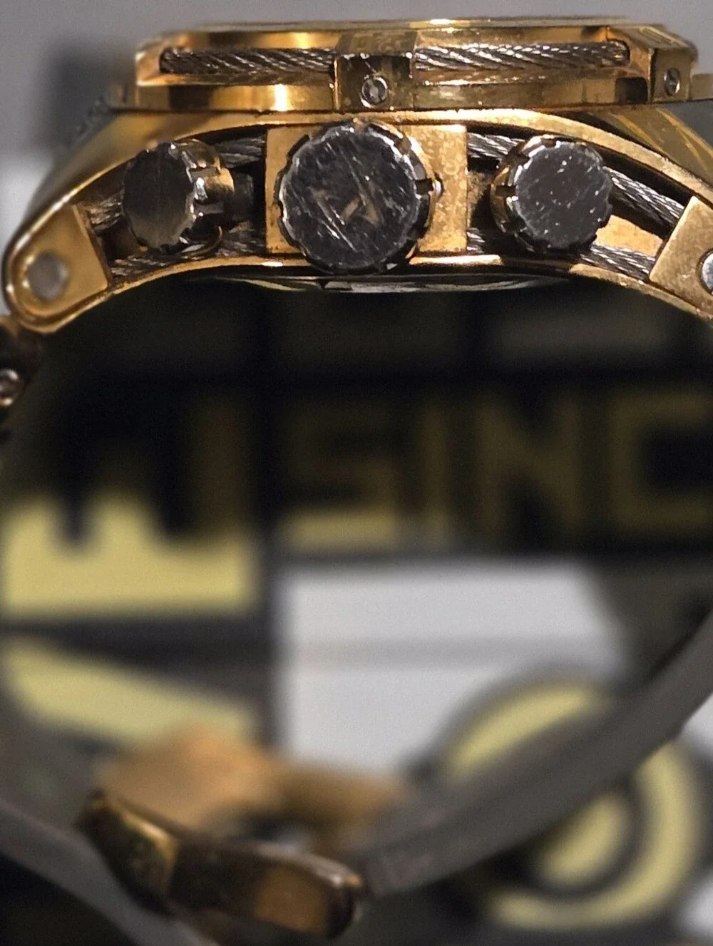 Invicta Gold and Black Chronograph Watch with Gray Strap